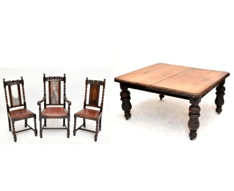 A Victorian oak extending dining table with extra leaf, raised on substantial acanthus carved baluster supports to castors, l