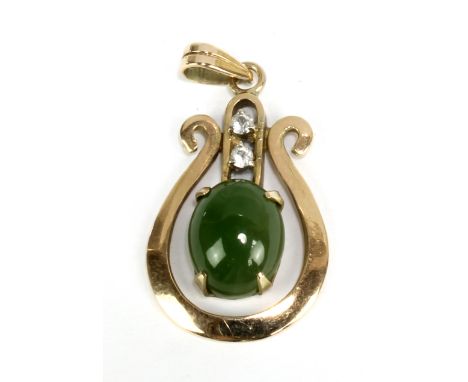 A 14ct yellow gold jade set pendant of pierced form, length including bail 3cm, approx 2.3g.