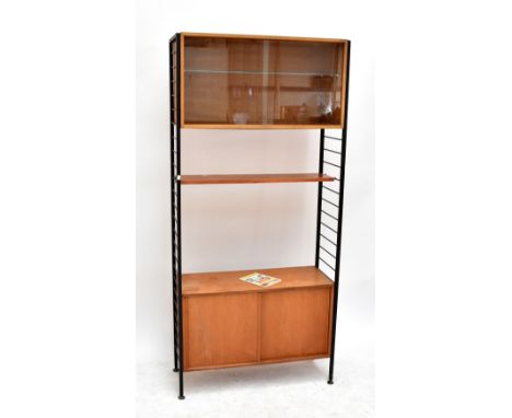 STAPLES LADDERAX; a teak modular wall unit comprising glazed cabinet enclosing single glass shelf above single shelf and cupb