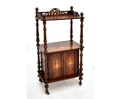 A Victorian walnut and inlaid two tier whatnot, with ring turned and wrythen columns, on cupboard base to castors, height 108