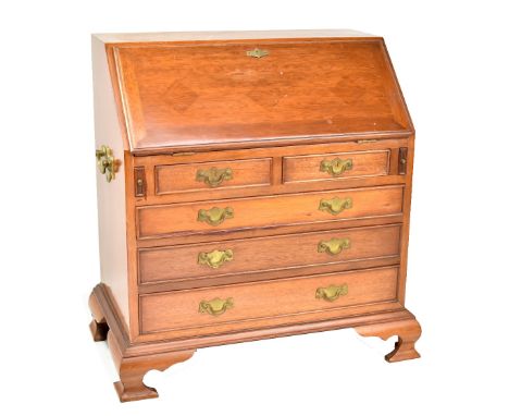 MAITLAND &amp; GLASCOE OF LONDON; a George II style mahogany miniature bureau, the fall front enclosing a fitted interior abo