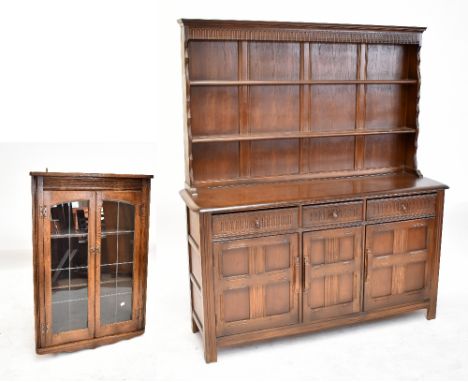 An oak Priory-style dresser, the two-shelf boarded plate rack above three short drawers and three cupboard doors, 176.5 x 151