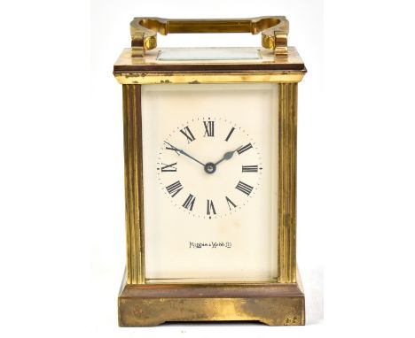 MAPPIN &amp; WEBB LTD; a brass cased carriage clock, the circular dial set with Roman numerals, with bevelled glass panels, n