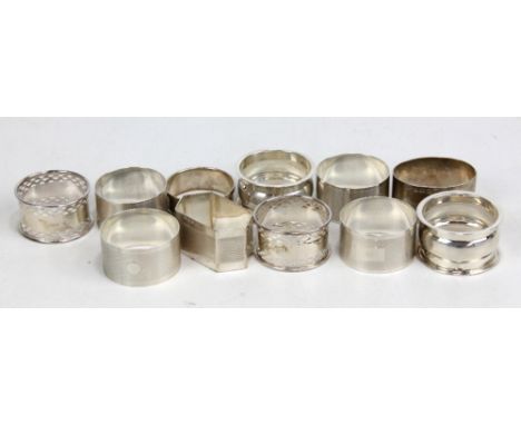 Eleven variously hallmarked silver napkin rings to include a pair of pierced examples, maker's initial AJP, London 1926, a fu