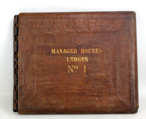 A leather bound ledger titled 'Managed Houses Ledger no.1' with Pearce &amp; Gardner label to interior, 37.5 x 45.5cm.Additio