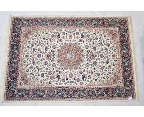 A cream ground Keshan carpet, 230 x 160cm.