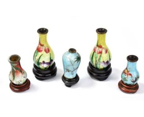 A garniture of four Japanese Meiji period ginbari and floral cloisonne enamel miniature baluster vases, each bearing two char