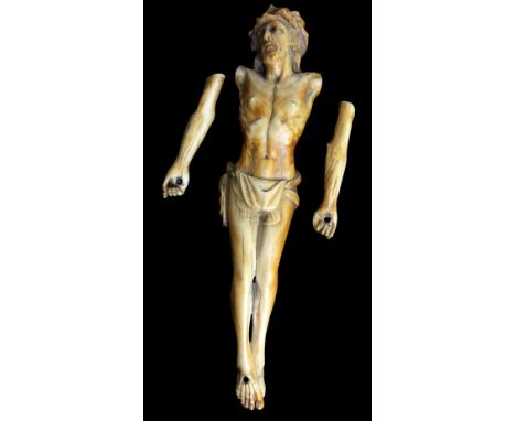 A carved ivory Corpus Christi, probably Italian 18th century, height 26.5cm (af).Additional InformationThe arms would have or