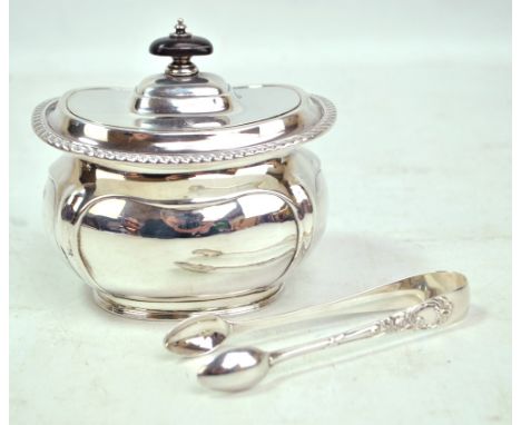 HARRISON BROS &amp; HOWSON; a George V hallmarked silver tea caddy of oval bellied form, the hinged lid with rope twist rim a