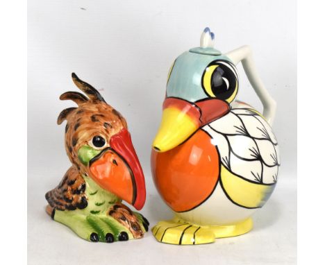 LORNA BAILEY; a 'Wally the Wader' stylised bird figure, height 18.3cm, and a jug/decanter modelled as a bird (af) (2).Additio