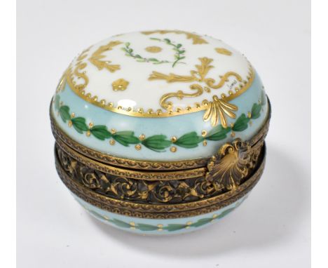 A Continental porcelain and gilt metal trinket box with enamelled and gilt foliate decoration, signed 'Lomas' to lid and with