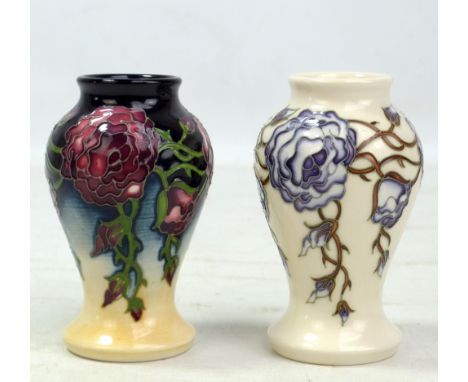 MOORCROFT; two floral tubeline decorated miniature baluster vases, both with impressed marks and year ciphers for 2009 to bas