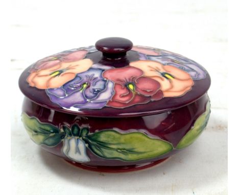 MOORCROFT; a purple ground 'Pansy' pattern tubeline decorated lidded bowl, impressed marks and year cipher for 1994 to base, 