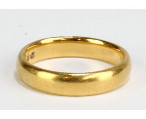 A 22ct yellow gold wedding band, size K, approx 4.4g.