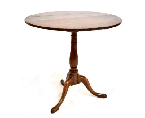 A George III oak circular tilt-top tripod table.&nbsp;