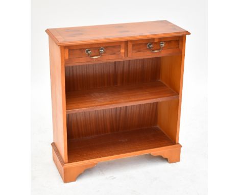 A yew wood open bookcase with two short drawers over single shelf on bracket feet, 83 x 74.5cm.