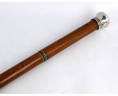 A Victorian hallmarked silver topped malacca cane with screw off glass spirit flask compartment to upper part, dated Birmingh