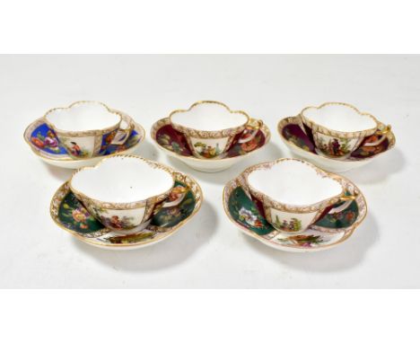 A set of five Continental porcelain cabinet cups and saucers of quadrilobed form with alternating enamel painted panels depic