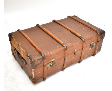 A twin handled canvas travelling trunk with cane and leather fittings initialled 'F.A.W' to each side, length 101cm.Additiona