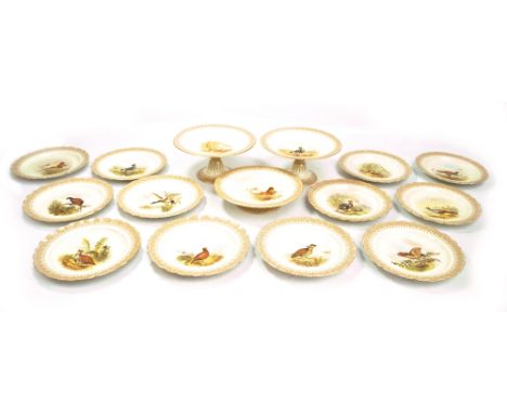 ROYAL WORCESTER; a set of twelve 'Vitreous' plates, each transfer decorated with a different game bird within an ornamental b