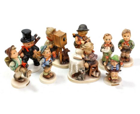 GOEBEL; nine figures of boys in various poses including two larger sized examples (9).&nbsp;