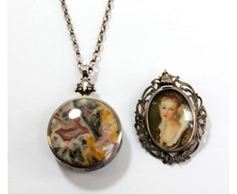 A Continental 800 grade silver foliate motif pendant with painted portrait miniature of a young lady to centre, length 4.5cm,