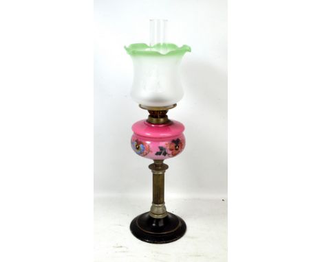 An oil lamp with reeded chrome plated column, pink glass and floral enamel decorated reservoir, duplex burner, clear glass ch