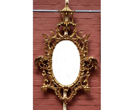 A Chinese Chippendale style gilt pagoda mirror, the oval glass flanked by twin hoho birds, length approx 142cm (af).Additiona