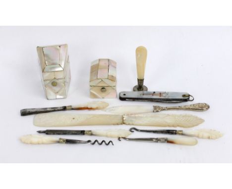 A 19th century mother of pearl thimble case with white metal thimble, a needle case, a page turner with carved decoration, a 