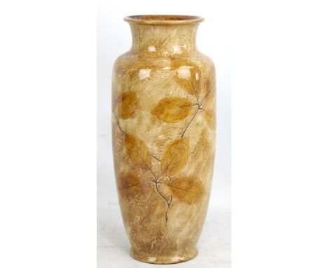 ROYAL DOULTON; a large stoneware cylindrical vase decorated in autumnal colours with leaves, impressed marks to base numbered