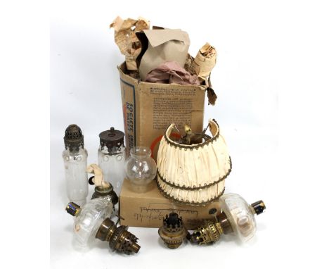A small mixed lot of oil lamp parts including burners, chimneys, etc.