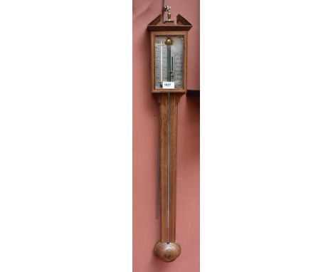 A mahogany and inlaid stick barometer with broken swan neck pediment and urn finial, length 96cm.