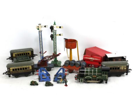 A group of early Hornby 0 gauge trains and accessories, including a 'Southern A179' engine and tender in green livery, three 