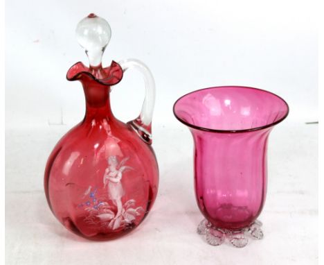 A cranberry glass ewer with Mary Gregory-style enamelled decoration and clear stopper (af), height 25cm, and a vase (2).Addit