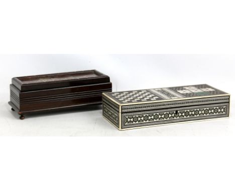 An Anglo-Indian Vizagapatam micromosaic inlaid games box with chess and cribbage board to hinged lid enclosing backgammon boa