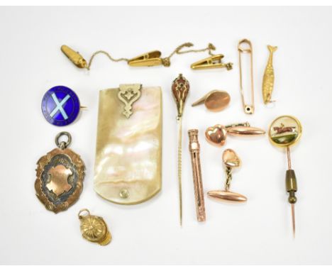 A group of yellow metal jewellery including equestrian motif stick pin, jockey cap charm inset with compass, pair of cufflink