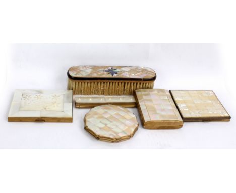Three mother of pearl mounted powder compacts, a cigarette case, a comb and a brush.Additional InformationGeneral wear throug