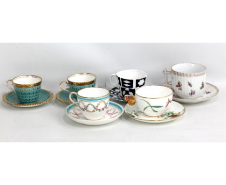 AYNSLEY; a pair of early 20th century cups and saucers with gilt decoration on a turquoise ground, diameter of saucers 13cm, 