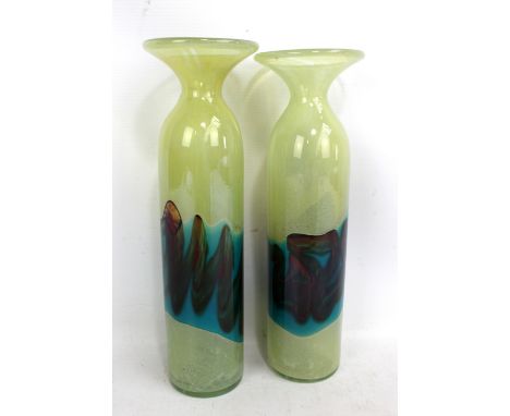 A pair of art glass vases of tall slender form with flared rims on light yellow ground with turquoise and dark red bands, unm