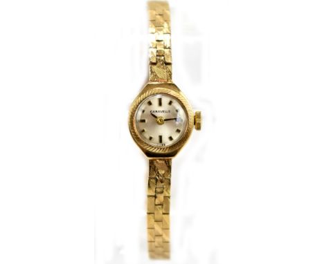 CARAVELLE; a lady's 9ct yellow gold mechanical cocktail watch, the circular dial set with baton numerals, dial diameter exclu