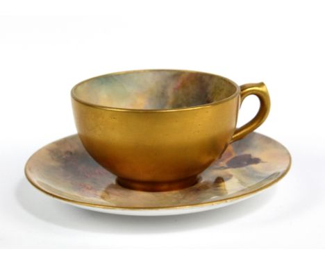 HARRY STINTON FOR ROYAL WORCESTER; an early 20th century hand painted and gilt miniature tea cup and saucer, the interior of 