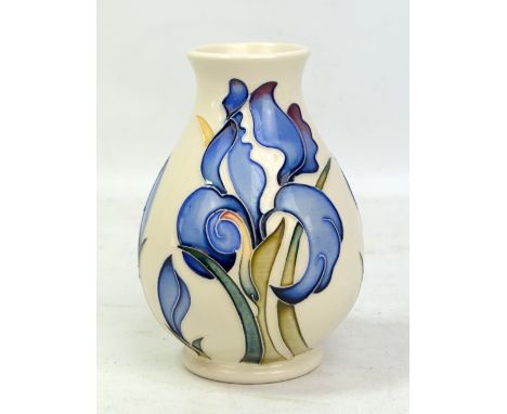 MOORCROFT; a white ground floral decorated baluster vase, with impressed marks and year cipher for 2009 to base, height 13.8c