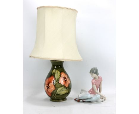 MOORCROFT; a 'Hibiscus' pattern tubeline decorated baluster table lamp, impressed marks and Queen Mary Royal Appointment Labe