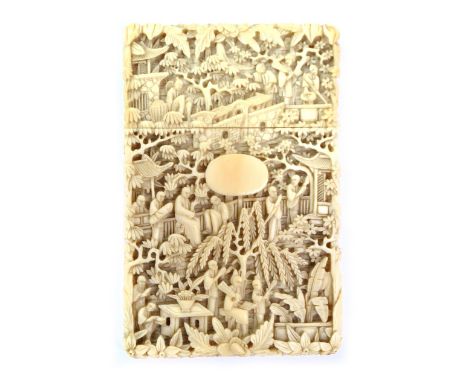 A 19th century Chinese Export ivory card case of rectangular form, elaborately carved in relief with figural and architectura