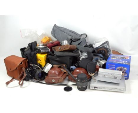 A quantity of cameras including Canon EOS300 kit, Olympus OM10, Cosina CSR, Polaroid 600AF and related accessories.