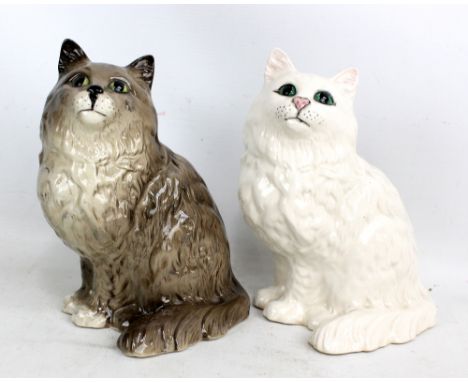 BESWICK; two seated cats in white and grey colourways, the former with impressed marks and no. 1867 to base, height of each a