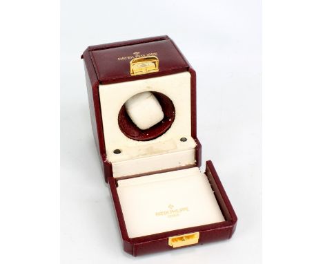 PATEK PHILIPPE; a battery operated watch box for a single watch (interior deteriorated), width 12cm.Additional InformationNo 