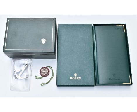 Rolex watch box with suede interior, chronometer charm, Oyster anchor charm and 2011 diary and address book, in original box.