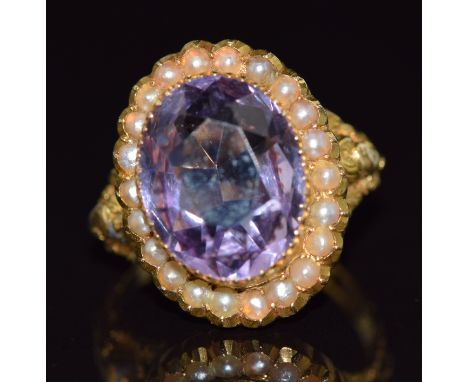Edwardian 18ct gold ring set with an oval cut amethyst and seed pearls, London 1908, maker J.C, 5.3g, size N&nbsp;