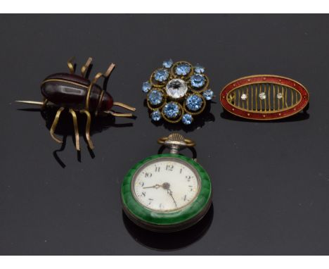 A silver fob watch set with enamel depicting a couple, and three brooches
